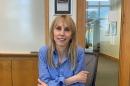 Sherri Cannon sits at a conference table at Paul College.