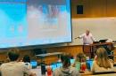 Rick Kilbride speaks to his financial scandals class at UNH.